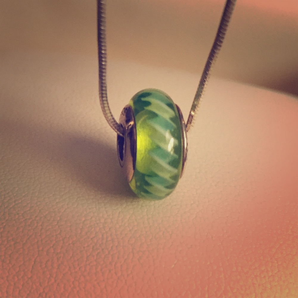 Green and white glass Pandora charm